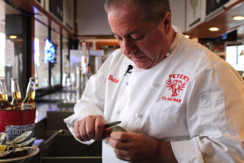 Owner Butch shucking oysters